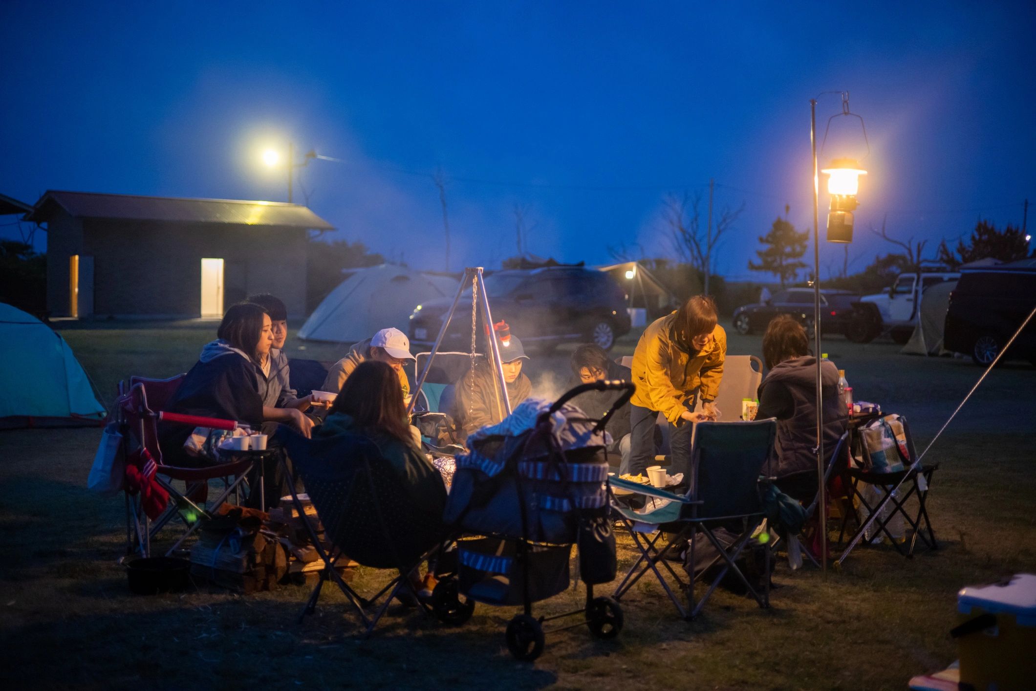 Families camping together at night