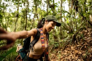 Young tourist woman hiking on forest