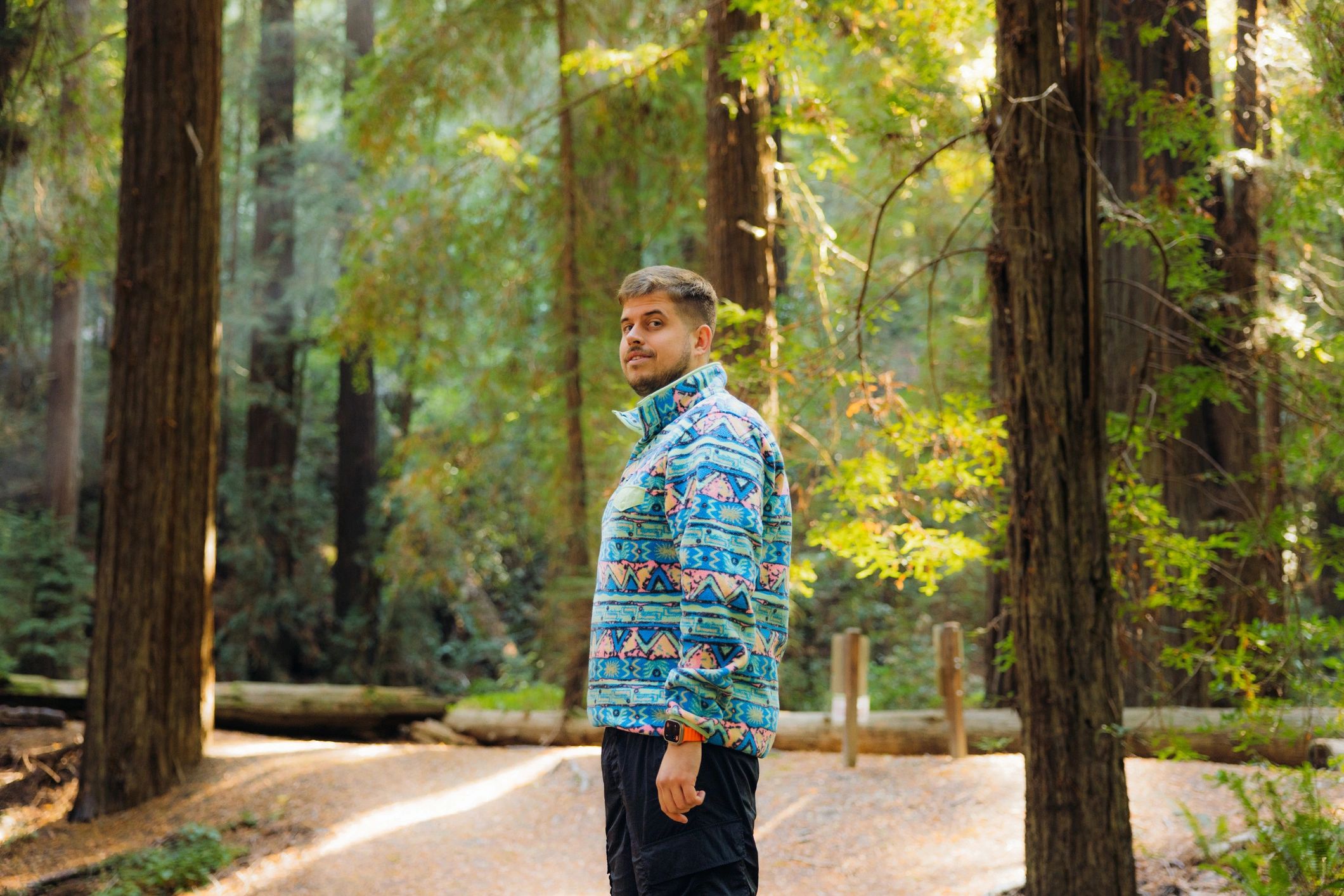 Hiker walking through a forest trail