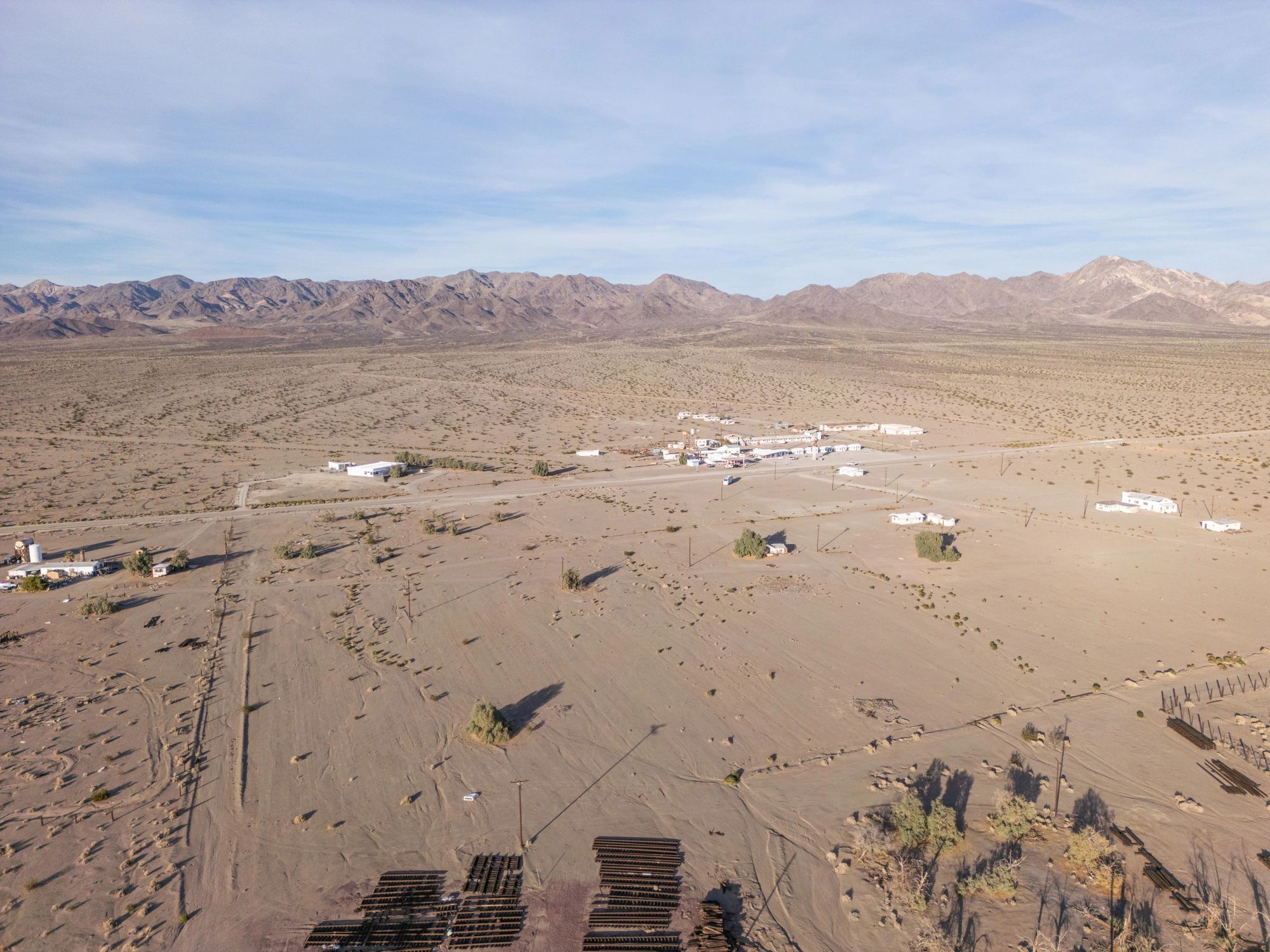 Aerial View of Desert Settlement and Mountain Range